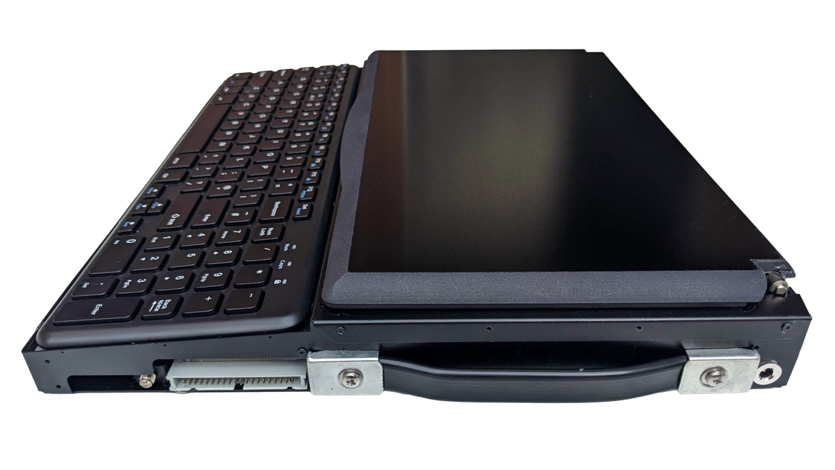 Side on photo of the right side Canute Scientific when closed. The lid is closed over the Braille display. The visible ports from the back are the power socket, 40-pin out and external WiFi aerial connector. The folded aluminium chassis includes a heavy duty pull-out handle on the right side.